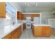 This open kitchen features an island and stainless steel appliances at 849 Ringwood Ln, Las Vegas, NV 89110