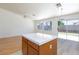 The kitchen island features white countertops and wood cabinets at 849 Ringwood Ln, Las Vegas, NV 89110