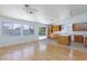 Open concept living room and kitchen space, with backyard views at 849 Ringwood Ln, Las Vegas, NV 89110