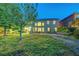 Expansive backyard showcasing a patio, a hammock, and mature landscaping at 8812 Glenistar Gate Ave, Las Vegas, NV 89143