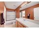 Bathroom featuring a shower/tub combo, modern vanity, and tile countertop at 8812 Glenistar Gate Ave, Las Vegas, NV 89143