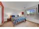 Spacious bedroom with neutral carpet, bright walls, a large window, and nice furnishings at 8812 Glenistar Gate Ave, Las Vegas, NV 89143