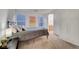 Bright bedroom features two large windows, an ensuite bathroom, and a wardrobe at 8812 Glenistar Gate Ave, Las Vegas, NV 89143
