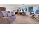 Upper-level bonus room showing comfortable sitting area and desk area at 8812 Glenistar Gate Ave, Las Vegas, NV 89143