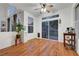 Bright dining area with wood floors, a ceiling fan and access to the backyard at 8812 Glenistar Gate Ave, Las Vegas, NV 89143