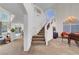 Open entryway with stairway, chandelier, and high ceilings welcome you at 8812 Glenistar Gate Ave, Las Vegas, NV 89143