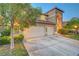 Home with a large driveway and three-car garage at 8812 Glenistar Gate Ave, Las Vegas, NV 89143