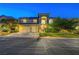 Charming two-story home with a three-car garage and lush landscaping in a well-lit neighborhood at 8812 Glenistar Gate Ave, Las Vegas, NV 89143