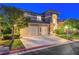 Inviting two-story home featuring a convenient three-car garage and well-maintained landscaping at 8812 Glenistar Gate Ave, Las Vegas, NV 89143