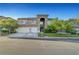 Attractive two-story home features a three-car garage and well-manicured front yard at 8812 Glenistar Gate Ave, Las Vegas, NV 89143