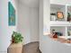 Hallway with decorative niche and contemporary artwork at 8812 Glenistar Gate Ave, Las Vegas, NV 89143
