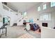 Bright living room with high ceilings, elegant fireplace, and open floor plan at 8812 Glenistar Gate Ave, Las Vegas, NV 89143