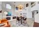 Spacious living room featuring a large chandelier, high ceilings, and ample natural light at 8812 Glenistar Gate Ave, Las Vegas, NV 89143