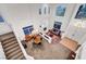 Spacious living room with high ceilings, fireplace, and large windows at 8812 Glenistar Gate Ave, Las Vegas, NV 89143