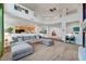 Expansive living area with steps down to a cozy seating area and open to the kitchen at 8812 Glenistar Gate Ave, Las Vegas, NV 89143