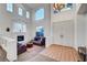 Bright living room featuring high ceilings, a fireplace, and stylish decor at 8812 Glenistar Gate Ave, Las Vegas, NV 89143