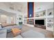 Large living area with fireplace and built-ins provides ample space for relaxation and entertainment at 8812 Glenistar Gate Ave, Las Vegas, NV 89143