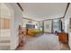 Spacious main bedroom boasts neutral colors, wood trim and a sitting area at 8812 Glenistar Gate Ave, Las Vegas, NV 89143