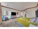 Large main bedroom with wood trim, TV, and an attached bathroom entrance at 8812 Glenistar Gate Ave, Las Vegas, NV 89143