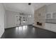Bright living area with brick fireplace, doors to backyard and pool at 9 Quail Run Rd, Henderson, NV 89014