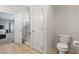 Clean bathroom showcasing tile flooring, toilet, and glass shower at 9004 Harbor Wind Ave, Las Vegas, NV 89178