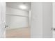 Spacious walk-in closet featuring carpet, overhead lighting, and closet rods at 9004 Harbor Wind Ave, Las Vegas, NV 89178