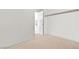 Empty closet with carpet and door to bathroom at 9004 Harbor Wind Ave, Las Vegas, NV 89178