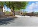 Charming two-story home with a two car garage, landscaping, and mature shade tree at 9004 Harbor Wind Ave, Las Vegas, NV 89178