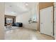 Spacious living room with tile flooring, natural light, and neutral paint at 9004 Harbor Wind Ave, Las Vegas, NV 89178