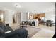Large living room with tile flooring, open to the kitchen and dining area at 9004 Harbor Wind Ave, Las Vegas, NV 89178