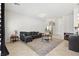 Inviting living room with tile flooring, neutral paint, and modern decor at 9004 Harbor Wind Ave, Las Vegas, NV 89178