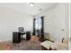 Office space with stylish black desk, comfortable chair, and lots of natural light at 9004 Harbor Wind Ave, Las Vegas, NV 89178