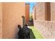 Narrow outdoor space featuring artificial turf, with a grill at 9112 Picturesque Ave, Las Vegas, NV 89149