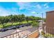 Balcony view of a street with trees and parked cars at 9112 Picturesque Ave, Las Vegas, NV 89149
