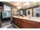 Bathroom with a double sink vanity, and neutral tiled floors at 9112 Picturesque Ave, Las Vegas, NV 89149