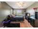 Neutral bedroom with dark furniture, plush carpet and soft, natural light at 9112 Picturesque Ave, Las Vegas, NV 89149