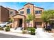 Charming two-story home with landscaped front yard and attached garage on a sunny day at 9112 Picturesque Ave, Las Vegas, NV 89149