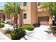 A close up of a well-maintained home with manicured landscaping and attached garage at 9112 Picturesque Ave, Las Vegas, NV 89149