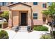 Charming home with landscaped front yard, covered porch, and attached garage at 9112 Picturesque Ave, Las Vegas, NV 89149