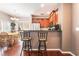 Eat-in kitchen featuring counter seating, stainless steel appliances, and wood cabinets at 9112 Picturesque Ave, Las Vegas, NV 89149