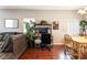 Open-concept living space with dining area, work area, and comfortable seating at 9112 Picturesque Ave, Las Vegas, NV 89149