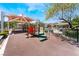 Colorful playground area with modern play structures and shade, ideal for activities at 9112 Picturesque Ave, Las Vegas, NV 89149