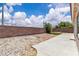 Spacious backyard featuring rock landscaping and a concrete patio at 918 Ambusher St, Henderson, NV 89014
