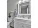 Bright bathroom featuring a modern white vanity and neutral wall color at 918 Ambusher St, Henderson, NV 89014