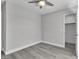 Neutral bedroom with a ceiling fan and open closet entrance at 918 Ambusher St, Henderson, NV 89014