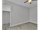 Bedroom with modern ceiling fan, closet and contemporary light gray flooring at 918 Ambusher St, Henderson, NV 89014
