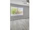 Bedroom with a large window, ceiling fan, and neutral paint color at 918 Ambusher St, Henderson, NV 89014