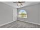 Bedroom with a large arched window and a ceiling fan at 918 Ambusher St, Henderson, NV 89014