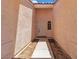 Inviting entryway featuring a well-lit alcove leading to the front door, enhancing curb appeal at 918 Ambusher St, Henderson, NV 89014