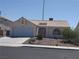 Charming single-story home features a desert landscape, and an attached two-car garage at 918 Ambusher St, Henderson, NV 89014